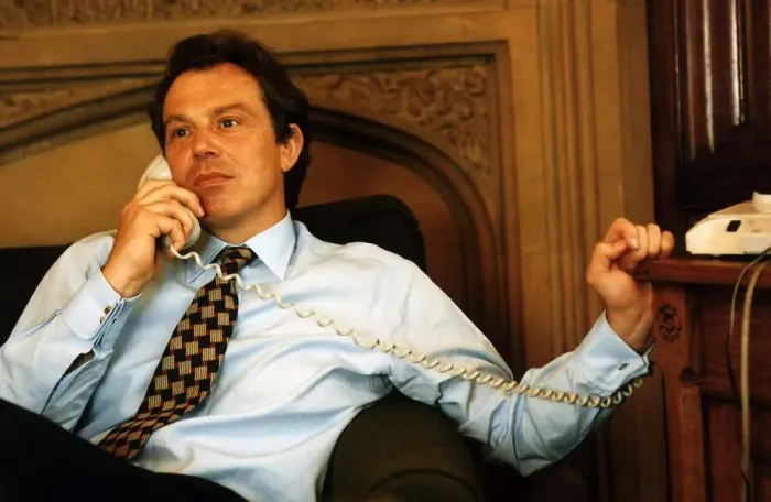 Framed Print : Tony Blair sitting on the sofa holding a telephone handset to his ear Framed Print : Tony Blair sitting on the sofa holding a telephone handset to his ear