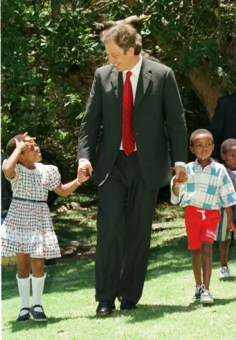 Framed Print : Tony Blair South Africa Visit January 1999 with the Aids child he sponsors Framed Print : Tony Blair South Africa Visit January 1999 with the Aids child he sponsors