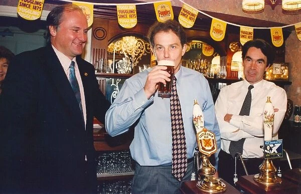 Tony Blair tries a pint of beer at Castle Eden Brewery