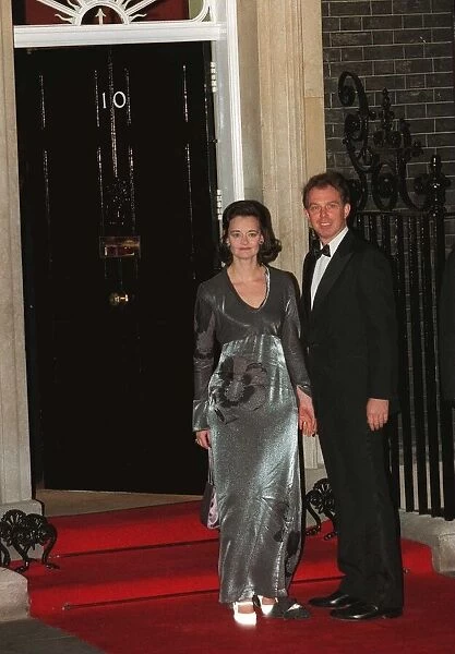 Tony Blair and his wife Cherie Blair outside number Ten Downing Street on their way to