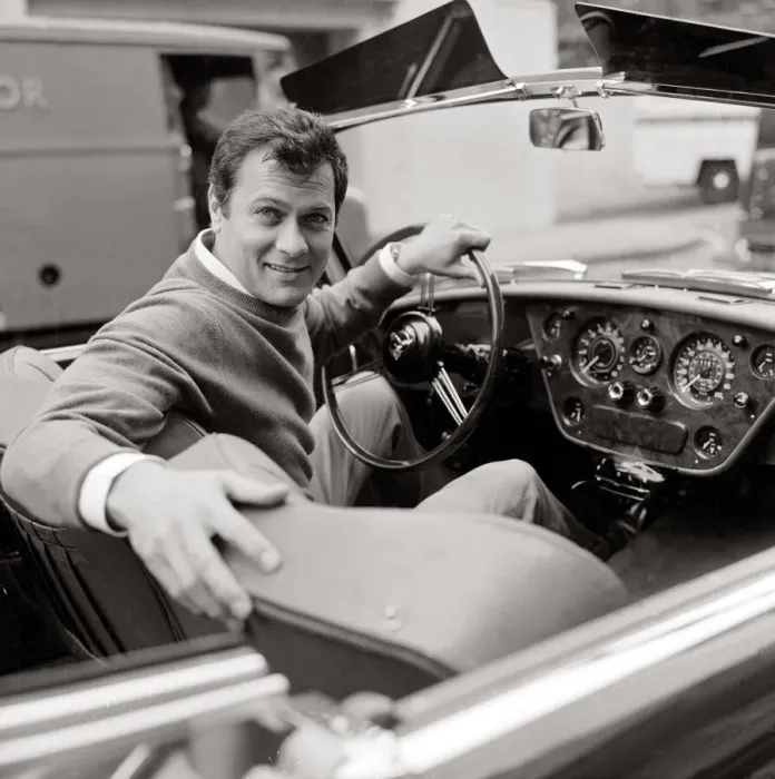 Framed Print : Tony Curtis, american actor poses for pictures in his Alvis TE21 motorcar in