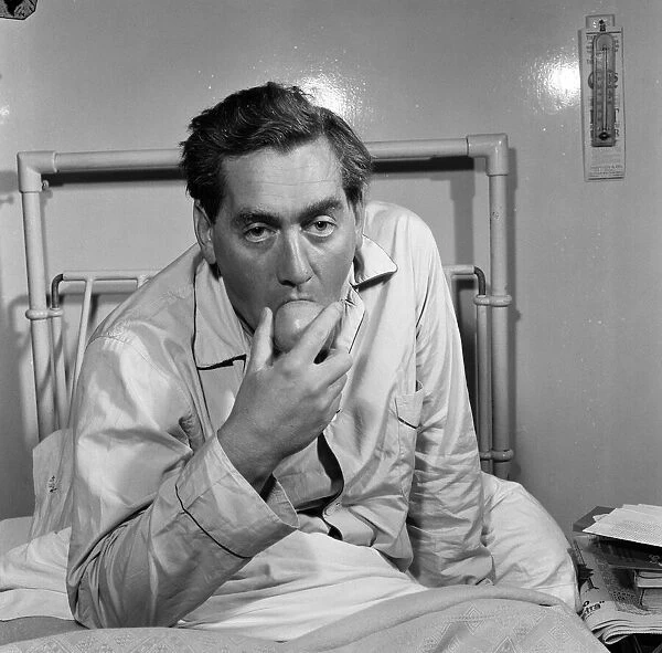 Tony Hancock pictured here from his hospital bed, 2nd August 1957