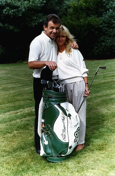 Tony Jacklin golfer cuddles a girlfriend January 1989