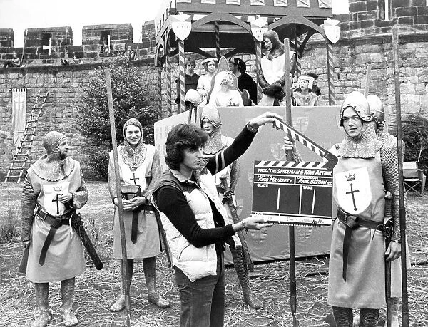 Tony Jackson holds high his clapper board at the making of the Disney film The Spaceman