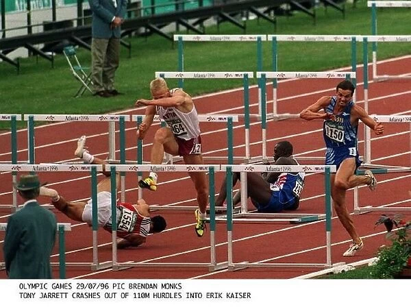 Tony Jarrett crashes out of the 110 Metre hurdles and into Erik Kaiser at the Olympic