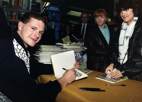 Tottenham and England footballer Paul Gascoigne signing copies of his book