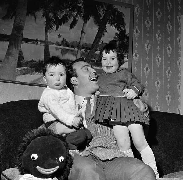 Tottenham Hotspur and England footballer Jimmy Greaves pictured with his two children