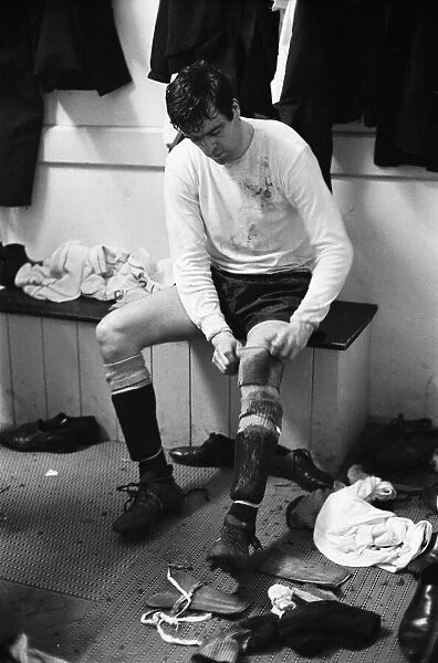 Tottenham Hotspur footballer Mike England in the dressing room after his comeback game