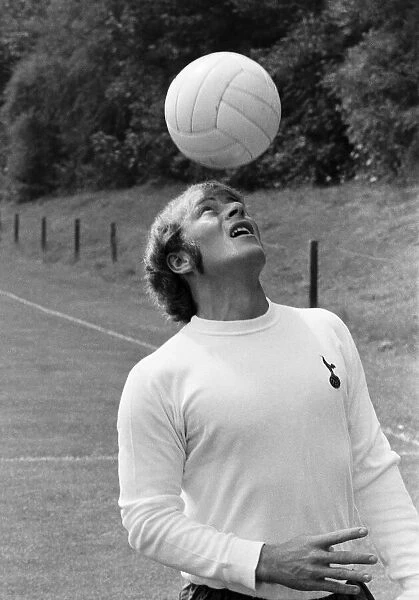 Tottenham Hotspur footballer Ralph Coates practices his heading skills during the Spurs