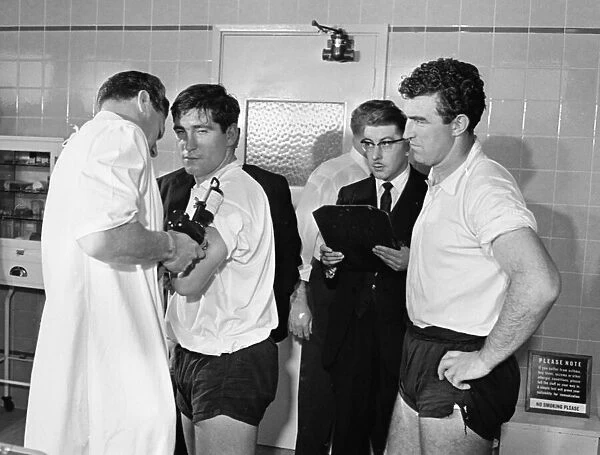 Tottenham Hotspur footballers line up for their flu innocculation