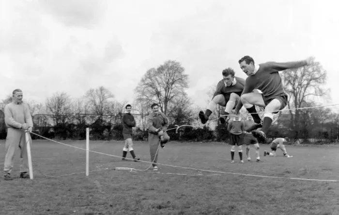 Framed Print : Tottenham Hotspur players Terry Dyson and Les Allen jumping over the rope in training Framed Print : Tottenham Hotspur players Terry Dyson and Les Allen jumping over the rope in training