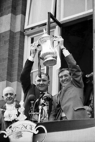 Tottenham Hotspur team captain Danny Blanchflower and manager Bill Nicholson hold the FA