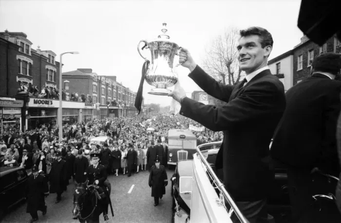 Framed Print : Tottenham Hotspur team hold the FA Cup trophy aloft from an open top double decker bus to Framed Print : Tottenham Hotspur team hold the FA Cup trophy aloft from an open top double decker bus to