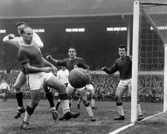 Framed Print : Tough moment for Ronnie Moran the Liverpool left when facing his own goal being tackled Framed Print : Tough moment for Ronnie Moran the Liverpool left when facing his own goal being tackled