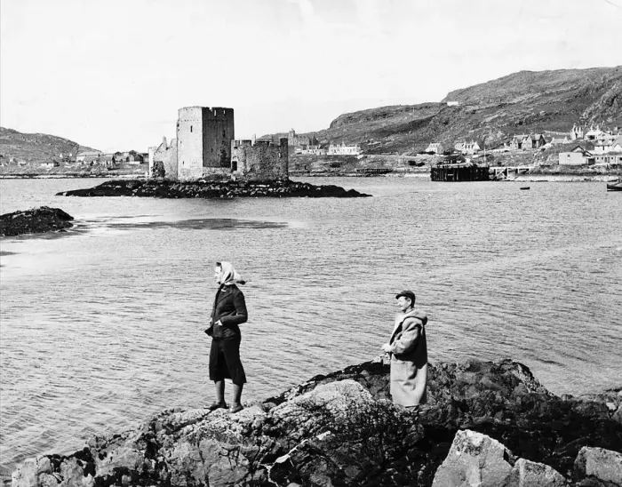 Framed Print : Tourists admire the scenery at Castlebay on the Island of Barra in Scotland Framed Print : Tourists admire the scenery at Castlebay on the Island of Barra in Scotland