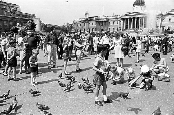 Tourists in Trafalgar Square, London, 10th August 1969