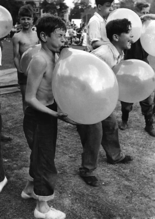 Framed Print : Toys Balloons: Peter Ash blowing up his balloons as part of a obstacle race Framed Print : Toys Balloons: Peter Ash blowing up his balloons as part of a obstacle race