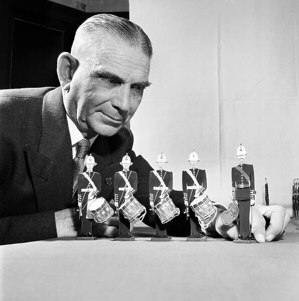 Toys: Man shows his display of toy figurines and soldiers. January 1954 A100-003