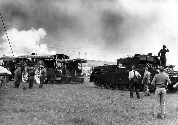 Traction engines and a tank having a tug of war at a Steam Rally on 10th June 1961