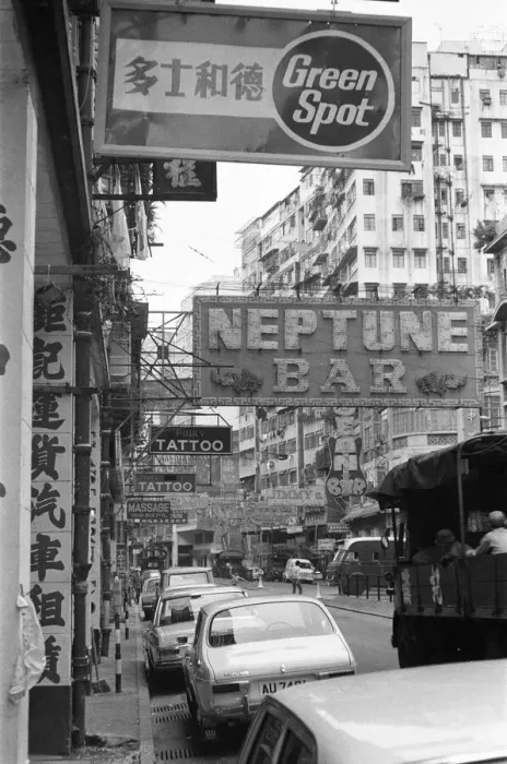 Framed Print : Traffic and signs advertising night clubs, tattoo and massage parlours seen here Framed Print : Traffic and signs advertising night clubs, tattoo and massage parlours seen here