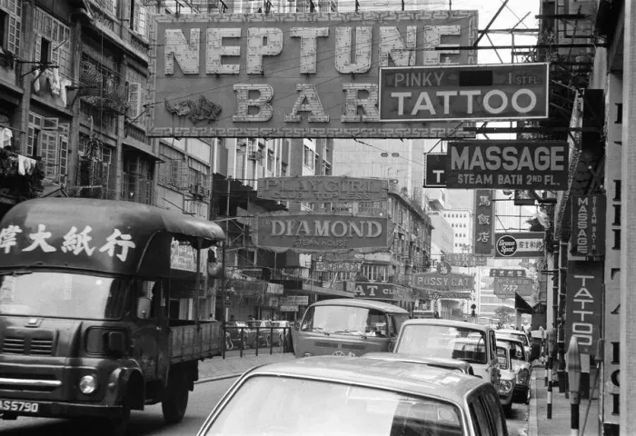 Framed Print : Traffic and signs advertising night clubs, tattoo and massage parlours seen here Framed Print : Traffic and signs advertising night clubs, tattoo and massage parlours seen here