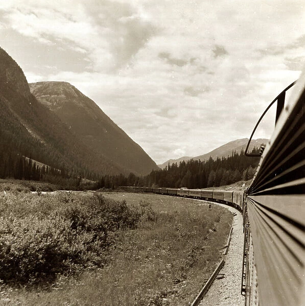 A train goes through the Rocky Mountains from Vancouver to Banff. Canada