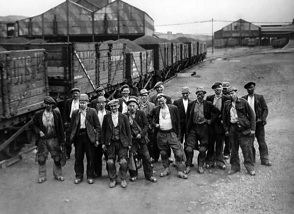 A train-Load in a day! Each of these sixteen miners, seen above, with the pit Deputy