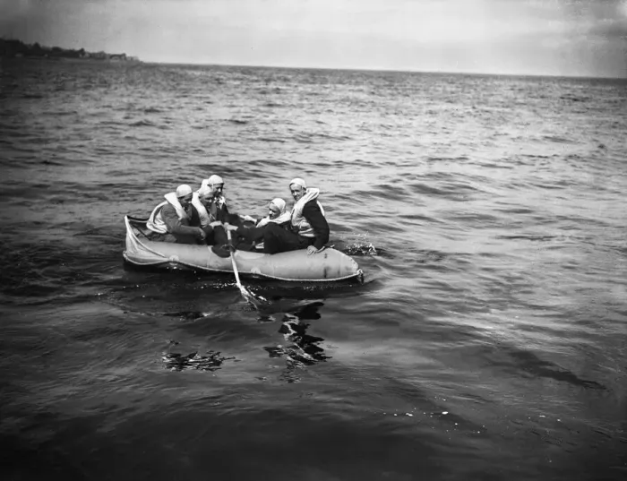 Framed Print : Training exercise for the Air Sea Rescue in the Solent. A downed fight pilot climbs Framed Print : Training exercise for the Air Sea Rescue in the Solent. A downed fight pilot climbs