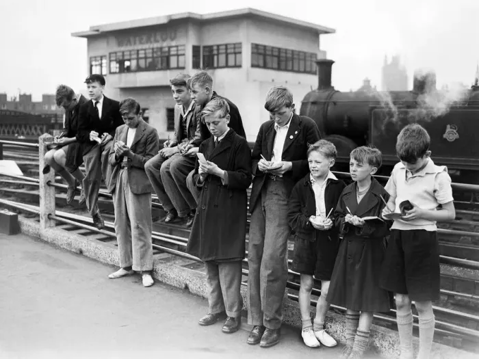 Framed Print : Trainspotters gather at the end of the platform at Waterloo station. August 1952 Framed Print : Trainspotters gather at the end of the platform at Waterloo station. August 1952