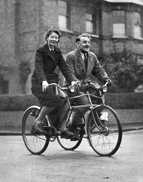 Transport: cycles: Blind mans tricycle. Mr. and Mrs. Mervyn Milsted on their tricycle