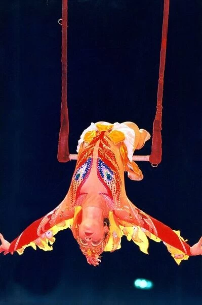 A trapeze artist performing at the Russian State Circus