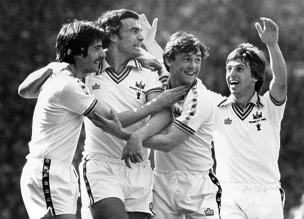 Trevor Brooking is congratulated by team mates Allan Devonshire