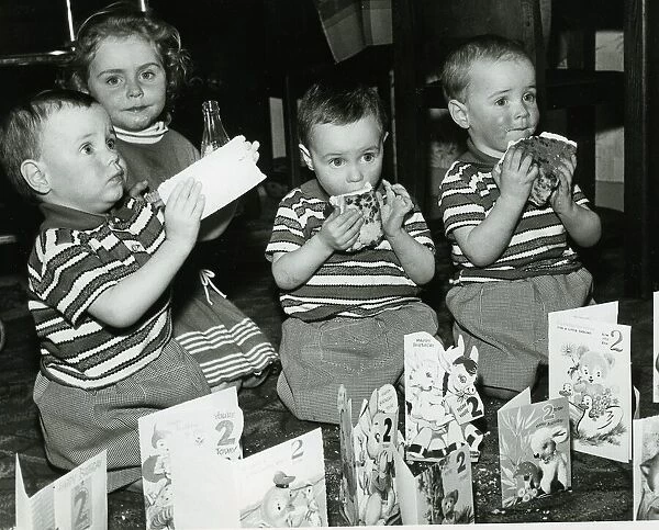 Triplets James Smith Jeremiah Smith and David Smith 1965 with sister eating
