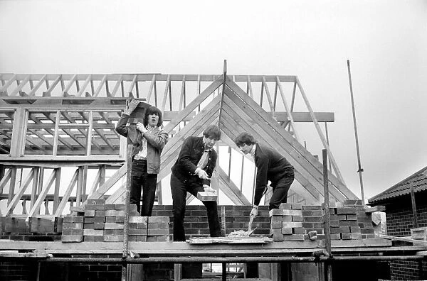 The Troggs, pop group help to build a house for one of their members