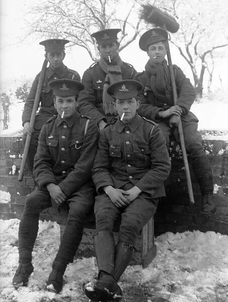 Troopers of the Royal Artillery take a break from their snow clearing duties to pose for