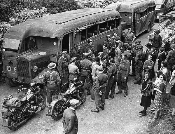 Troops enter their coaches after returning from the biggest ever Combined Operations