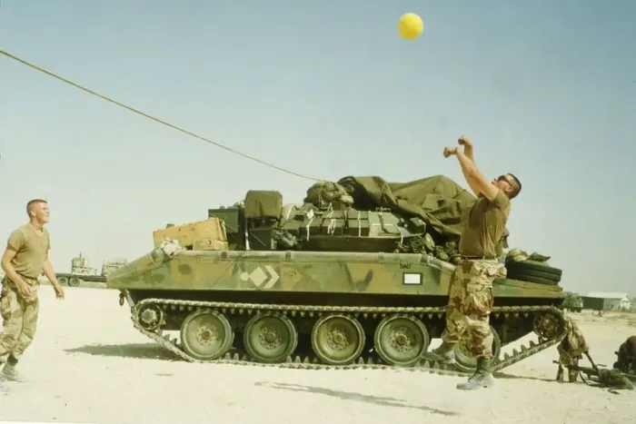 Framed Print : US troops play volley ball to pass the time during the build up of force before the start