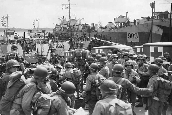 US Troops and supplies enroute to Normandy, June WW2. A scene at an