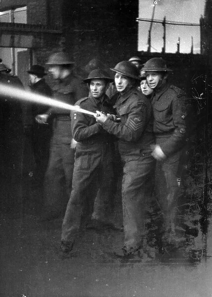 Troops supporting the N. F. S. and Fire Guards fighting fires in London. 13th March 1944