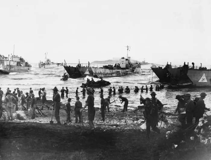 Framed Print : Troops unloading at Anzio. Men up to their waists in water, unloading stores Framed Print : Troops unloading at Anzio. Men up to their waists in water, unloading stores
