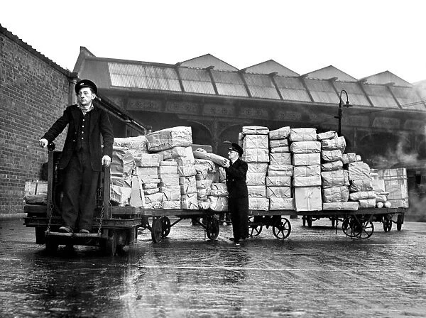 Truckloads of Xmas parcels on platform 17 of Victoria Station with parcel Porter Jim