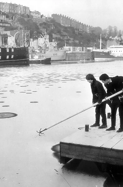 Trying to break the ice on a frozen floating harbour, Bristol