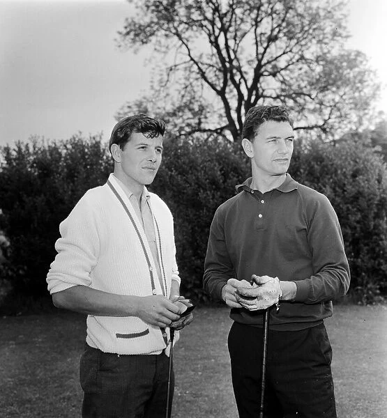 TT Riders Jim Redman (light shirt) and Phil Read playing golf. 29th June 1965