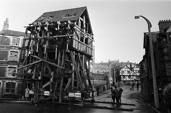 A Tudor house is moved to a new location within Exeter, Devon. 12th December 1961