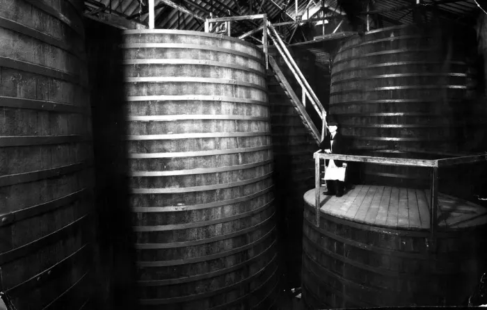 Framed Print : The Tun Room containing oak vats with Brewery Foreman Dan Rodway, 1930 s Framed Print : The Tun Room containing oak vats with Brewery Foreman Dan Rodway, 1930 s