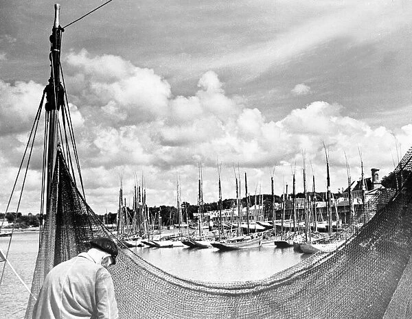 The Tunny fleet seen here repairing theire nets at Concarneau Brittany France. March 1938
