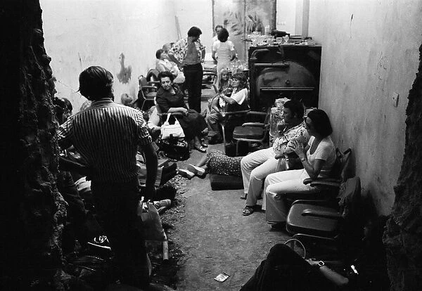 The Turkish invasion of Cyprus. Guests crowd together in the basement area of the Ledra