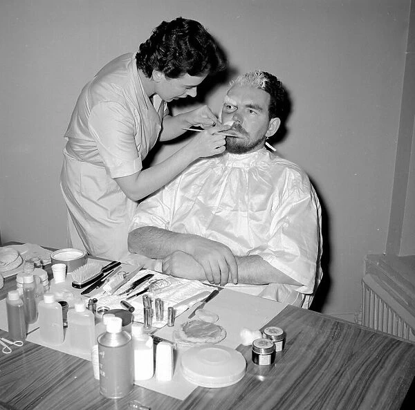 TV Make up artist seen here ageing an actor for a television drama Circa 1957