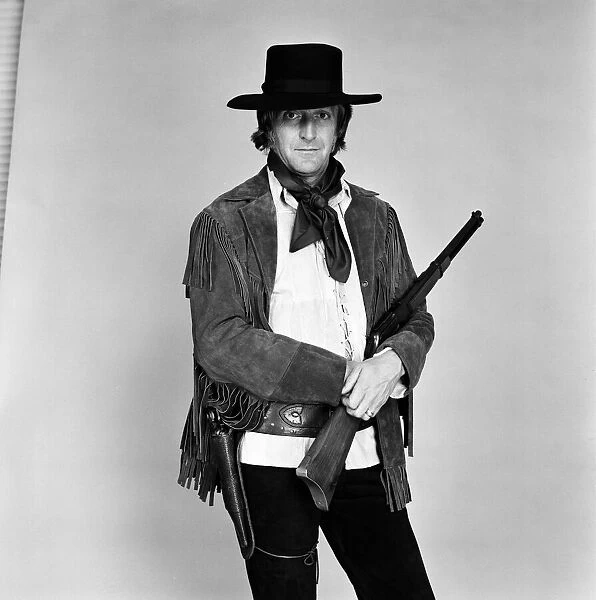 TV personality Michael Parkinson dressed in cowboy attire. 28th September 1972