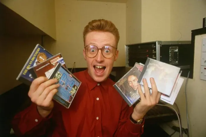 Framed Print : TV presenter Bryan Burnett holding various CD s Framed Print : TV presenter Bryan Burnett holding various CD s